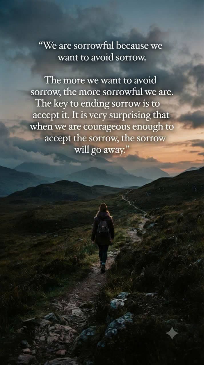 A person walking alone along a mountain trail at sunset, symbolizing the acceptance of sorrow and the journey toward inner peace.