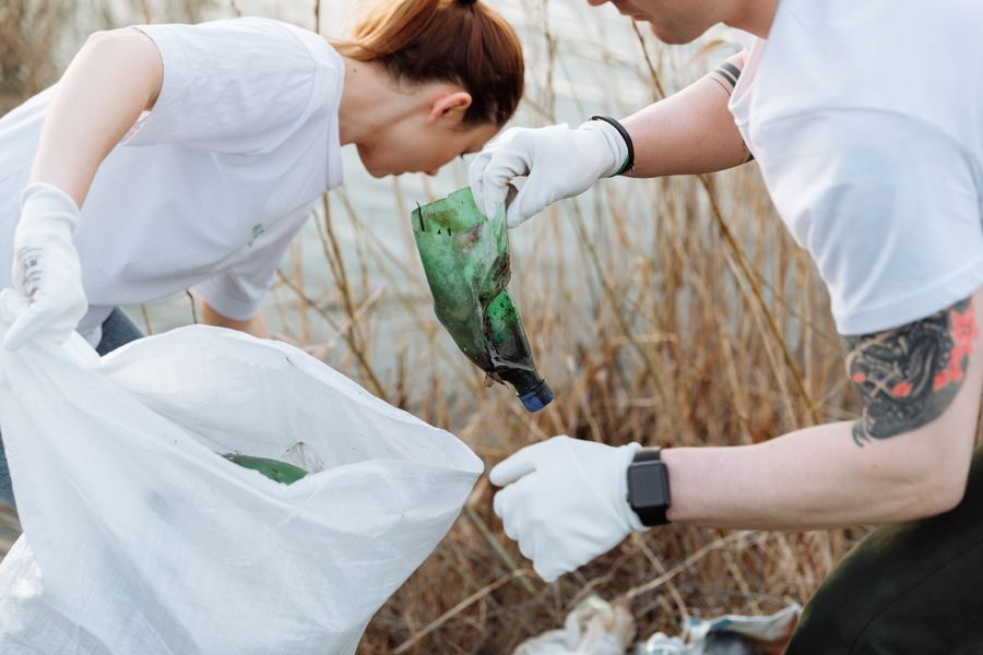 Volunteers picking up litter together outdoors